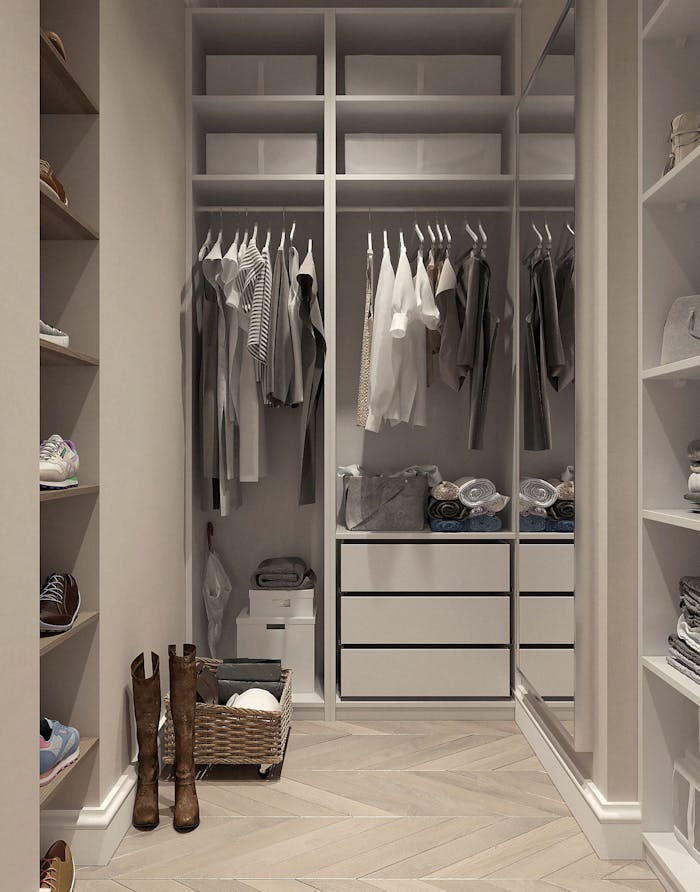about-01 Stylish walk-in closet with neutral tones and contemporary design elements.
